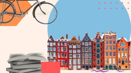 Häuserfront an den Amsterdamer Grachten, ein Fahrrad und Bücher