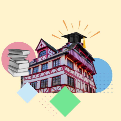 Ein historisches Haus in der Nürnberger Altstadt mit einem Doktorhut und einem Stapel Bücher